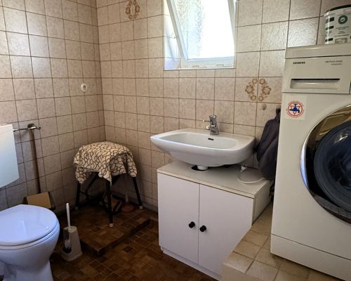 13 WC mit Hauswirtschaftsraum